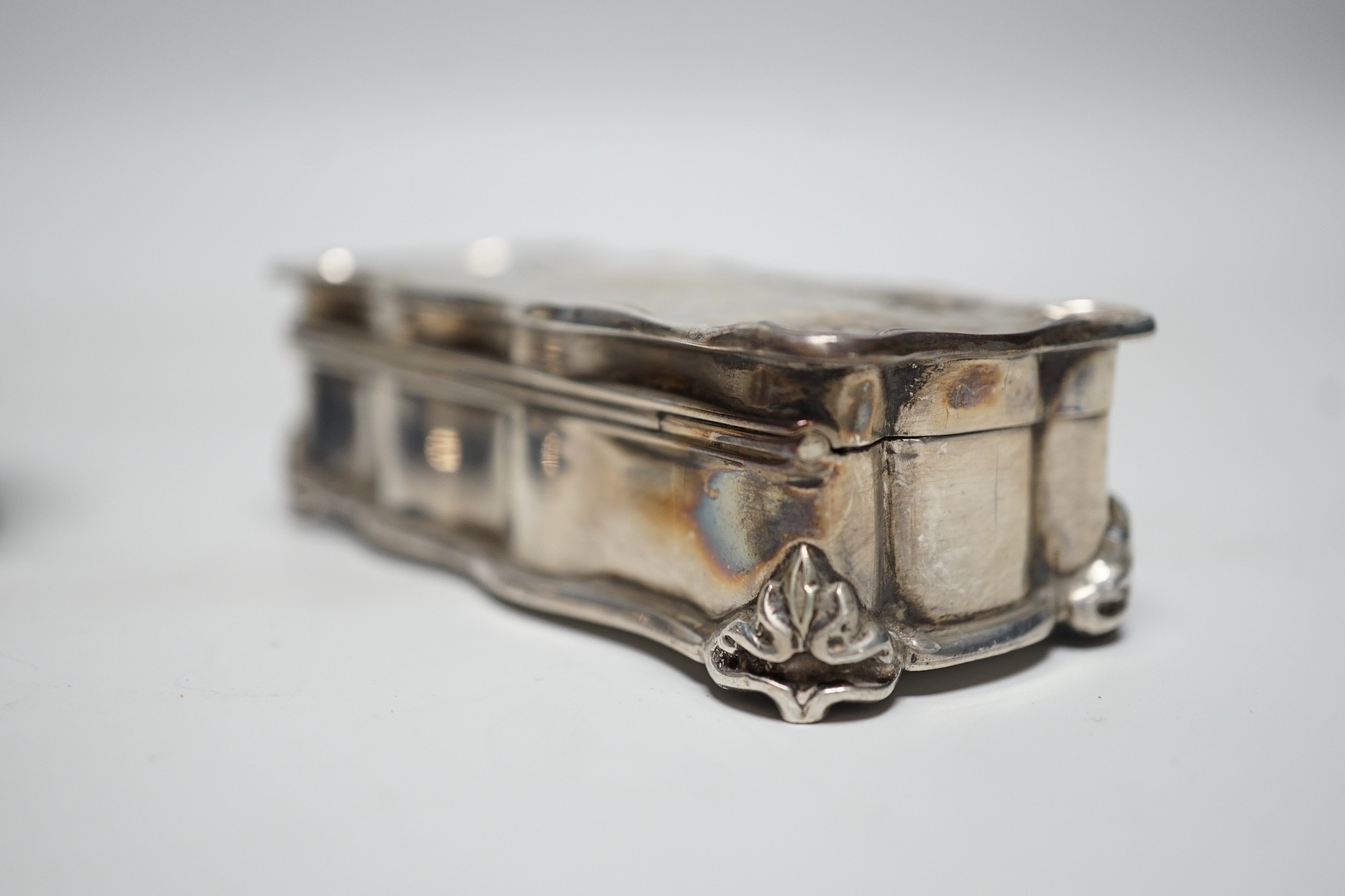 A George V silver and tortoiseshell mounted circular trinket box, Walker & Hall. Birmingham, 1918, 92mm and an earlier silver rectangular trinket box.